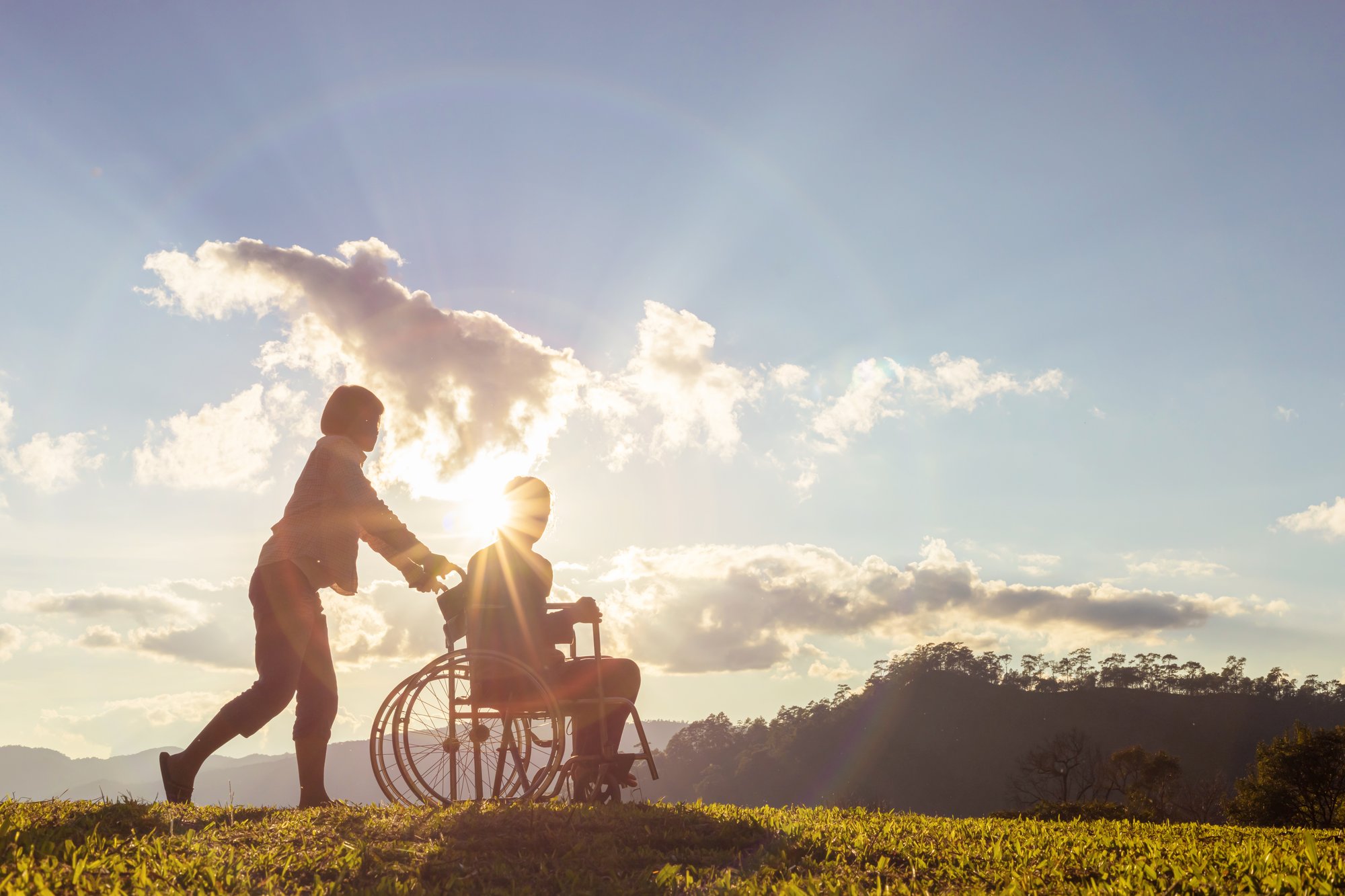 elderly man with caregiver on walk