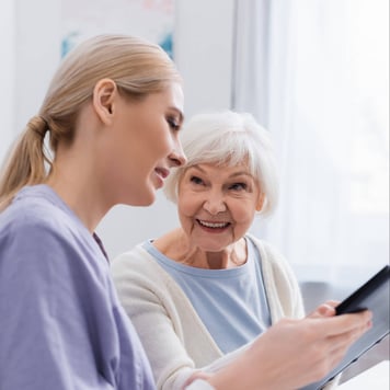 Female doctor explaining medical diagnosis to older woman patient